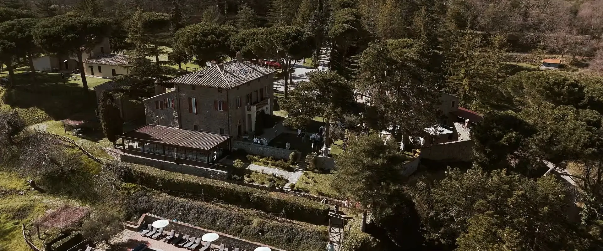 The estate seen from above, among the woods and hills of Umbertide, a frame from Andrew and Emily’s wedding film